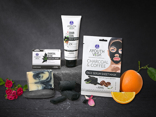 Ayouthveda Skin Detox Regimen with charcoal soap, charcoal face wash, and a charcoal and coffee sheet mask